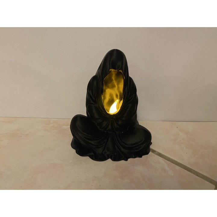 Mâge noir qui médite